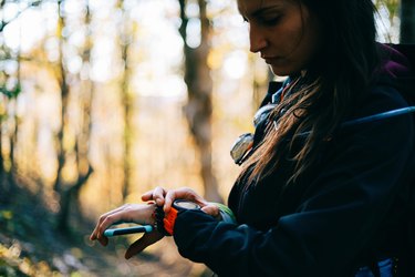 person on a hike around daylight saving time setting the time on an activity watch