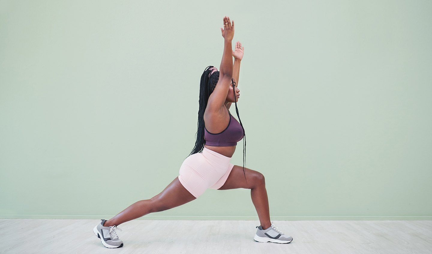 Woman using exercise band to lunge