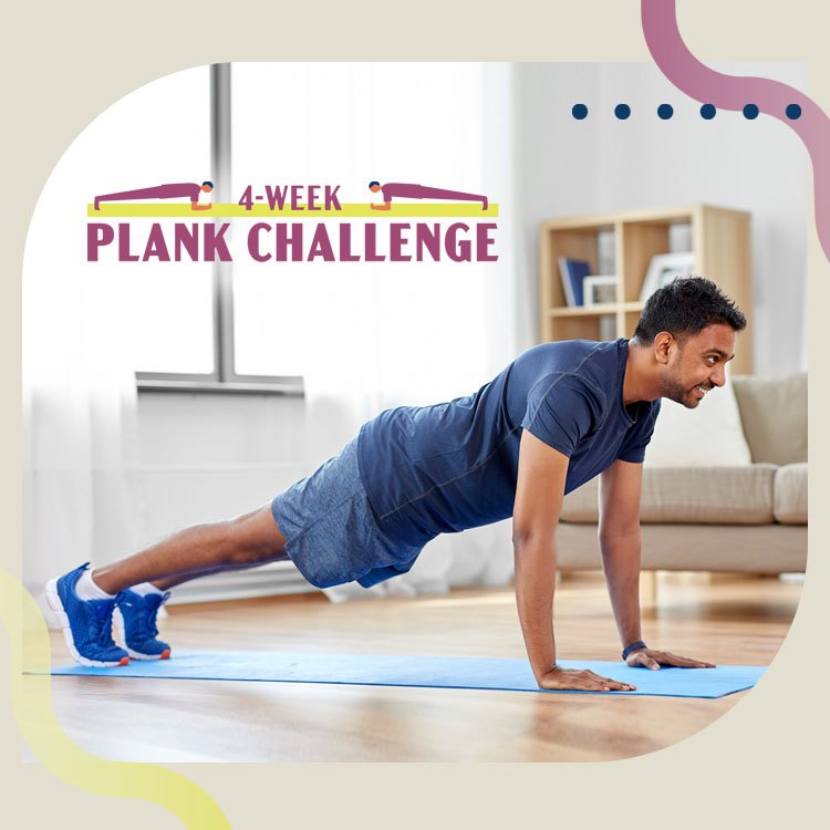 a person wearing gray shorts and a blue t-shirt performs a plank on a blue yoga mat at home