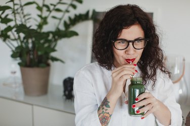 Young woman drinking vitamin C smoothie