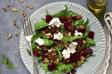 Warm beetroot salad with arugula, raisins and feta as the best foods to lower blood pressure
