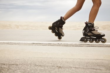 woman's legs rollerblading outside for 20-minute HIIT workout