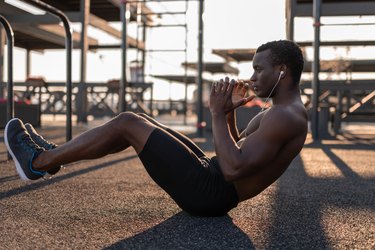 Fit black man doing ab exercises