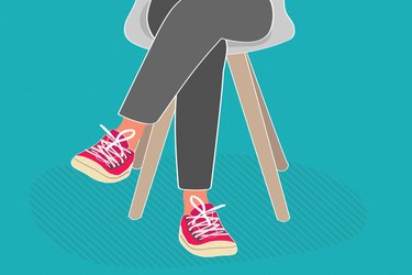 illustration of person's lower body with legs crossed wearing red sneakers on teal background