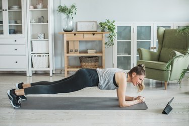 Woman doing a Pilates workout in her living room